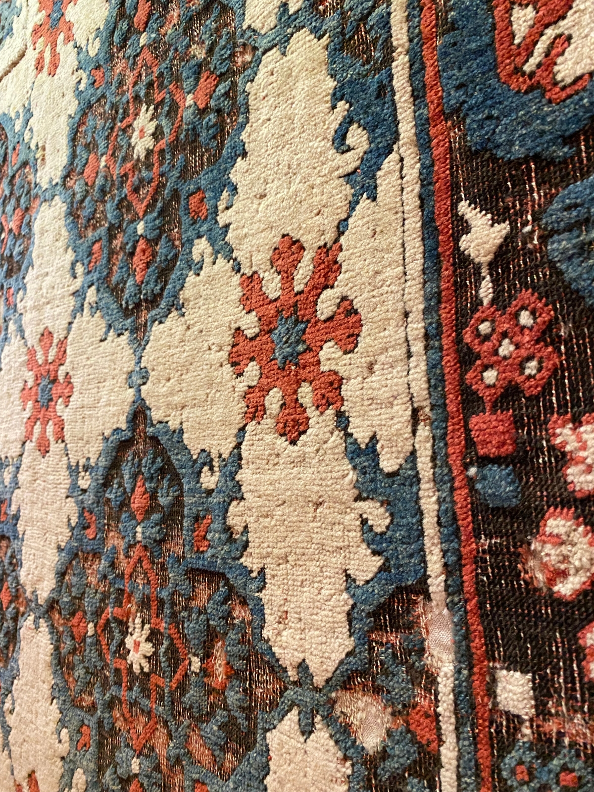 How do you maintain and protect a hand-woven rug?